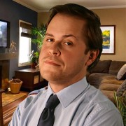 Serious-looking young man in a dress shirt and tie